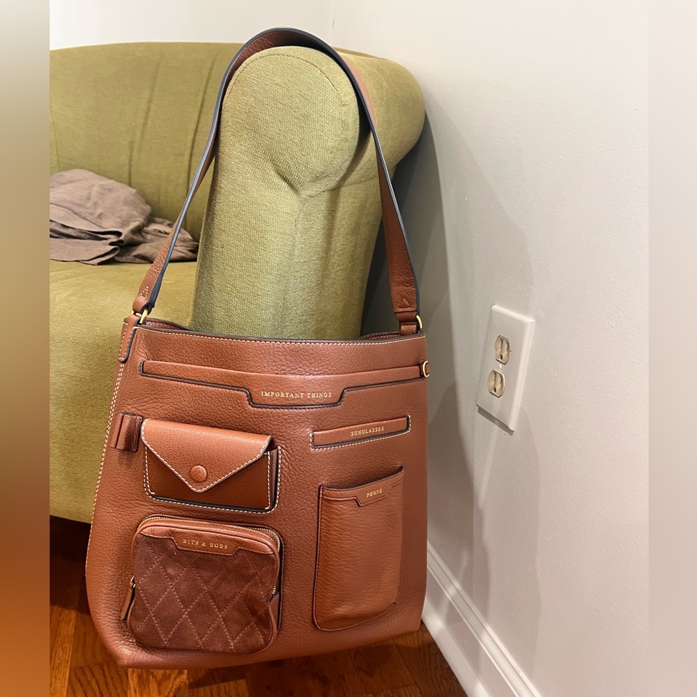 Anya Hindmarch multi pocket Hobo in brown leather

Dimensions: 11”x12.5”x14”x6”